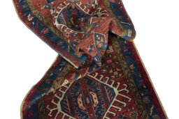 Corner detail of 1930s Heriz rug showing border pattern and Wool pile