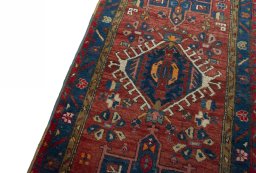Backside of handmade 1930s Heriz rug showing knot structure and weave density
