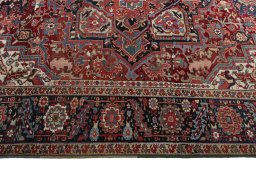 Corner detail of 1930s Heriz rug showing border pattern and Wool pile