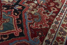Backside of handmade 1930s Heriz rug showing knot structure and weave density