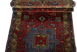 Corner detail of 1930s Heriz rug showing border pattern and Wool pile