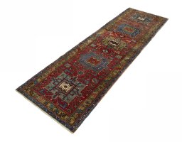 Corner detail of 1930s Heriz rug showing border pattern and Wool pile