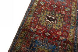Backside of handmade 1930s Heriz rug showing knot structure and weave density