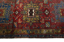 Full view of 1930s Heriz rug from Iran / Persia, 328 × 97 cm in Red tones