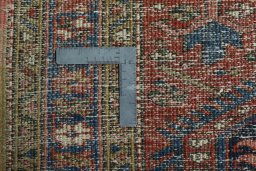 Close-up detail of 1930s Heriz rug from Iran / Persia showing Wool weave