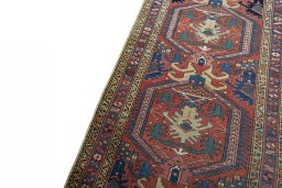 Backside of handmade 1930s Heriz rug showing knot structure and weave density