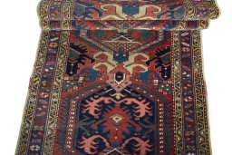 Full view of 1930s Heriz rug from Iran / Persia, 326 × 96 cm in Red tones