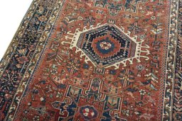 Backside of handmade 1930s Heriz rug showing knot structure and weave density
