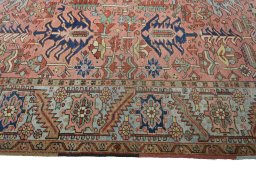 Full view of 1930s Heriz rug from Iran / Persia, 343 × 255 cm in Red tones