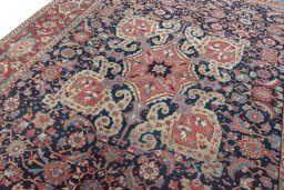 Backside of handmade 1930s Heriz rug showing knot structure and weave density