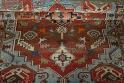 Corner detail of 1930s Heriz rug showing border pattern and Wool pile