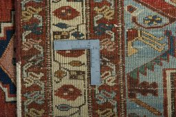 Surface texture of 1930s Heriz rug with natural Wool and intricate pattern