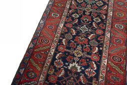 Backside of handmade 1930s Heriz rug showing knot structure and weave density