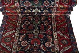 Full view of 1930s Heriz rug from Iran / Persia, 561 × 115 cm in Blue tones