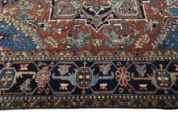 Corner detail of 1930s Heriz rug showing border pattern and Wool pile