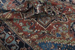 Surface texture of 1930s Heriz rug with natural Wool and intricate pattern