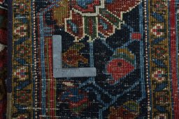 Surface texture of 1930s Heriz rug with natural Wool and intricate pattern