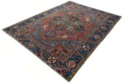 Corner detail of 1930s Heriz rug showing border pattern and Wool pile