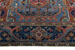 Full view of 1930s Heriz rug from Iran / Persia, 340 × 248 cm in Red tones