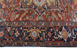 Corner detail of 1930s Heriz rug showing border pattern and Wool pile