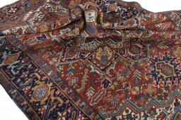 Surface texture of 1930s Heriz rug with natural Wool and intricate pattern