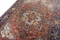 Backside of handmade 1930s Heriz rug showing knot structure and weave density