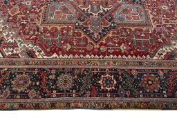 Corner detail of 1930s Heriz rug showing border pattern and Wool pile