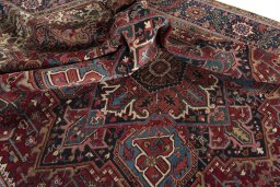 Surface texture of 1930s Heriz rug with natural Wool and intricate pattern