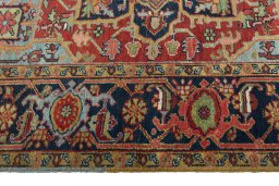 Corner detail of 1930s Heriz rug showing border pattern and Wool pile