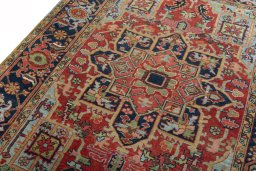 Backside of handmade 1930s Heriz rug showing knot structure and weave density