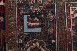 Backside of handmade 1930s Heriz rug showing knot structure and weave density