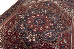 Backside of handmade 1930s Heriz rug showing knot structure and weave density