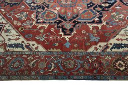 Corner detail of 1930s Heriz rug showing border pattern and Wool pile