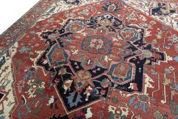 Backside of handmade 1930s Heriz rug showing knot structure and weave density