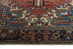Full view of 1930s Heriz rug from Iran / Persia, 335 × 235 cm in Red tones