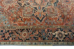 Corner detail of 1930s Heriz rug showing border pattern and Wool pile