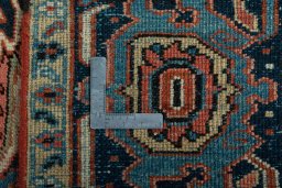 Backside of handmade 1930s Heriz rug showing knot structure and weave density