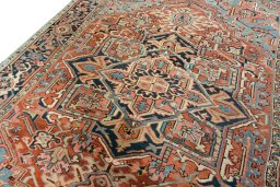 Backside of handmade 1930s Heriz rug showing knot structure and weave density