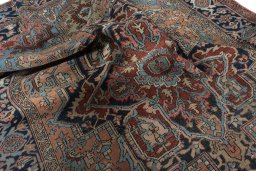 Backside of handmade 1930s Heriz rug showing knot structure and weave density