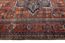 Corner detail of 1930s Heriz rug showing border pattern and Wool pile