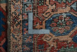 Backside of handmade 1930s Heriz rug showing knot structure and weave density