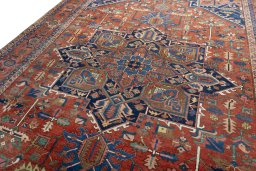 Backside of handmade 1930s Heriz rug showing knot structure and weave density