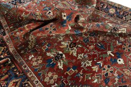Surface texture of 1930s Heriz rug with natural Wool and intricate pattern