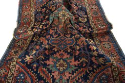 Surface texture of 1930s Heriz rug with natural Wool and intricate pattern