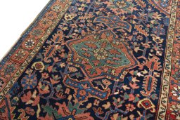 Backside of handmade 1930s Heriz rug showing knot structure and weave density