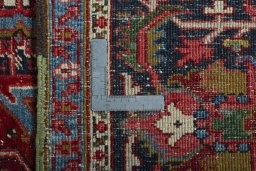Backside of handmade 1930s Heriz rug showing knot structure and weave density