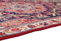 Backside of handmade 1920s Heriz rug showing knot structure and weave density