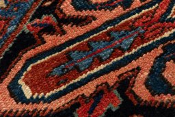 Backside of handmade 1990s Heriz rug showing knot structure and weave density