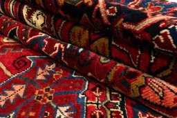 Surface texture of 2005s Heriz rug with natural Wool and intricate pattern