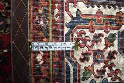 Backside of handmade 1970s Joshagan rug showing knot structure and weave density